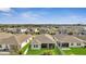 Sprawling community homes feature fenced yards and manicured lawns overlooking a serene pond at 338 Wooded Vine Dr, Winter Springs, FL 32708