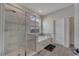 Luxurious bathroom featuring a glass-enclosed shower, a soaking tub, and neutral tile work at 338 Wooded Vine Dr, Winter Springs, FL 32708