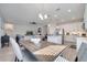 Open concept dining area adjacent to kitchen and living room, filled with natural light and modern furniture at 338 Wooded Vine Dr, Winter Springs, FL 32708