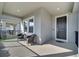 Inviting covered front porch with seating provides a welcoming entrance to the home at 338 Wooded Vine Dr, Winter Springs, FL 32708