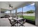 Spacious screened patio with ceiling fan, and furniture perfect for enjoying the backyard view at 338 Wooded Vine Dr, Winter Springs, FL 32708