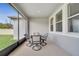 Covered patio with a dining set and ample natural light, perfect for outdoor meals and entertaining at 338 Wooded Vine Dr, Winter Springs, FL 32708