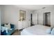 Comfortable bedroom with a soft armchair and full dresser adjacent to the walk-in closet at 3715 Bluethread Way, Poinciana, FL 34759