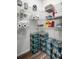 Well-stocked walk-in pantry with organized shelves and ample storage for food and household items at 3715 Bluethread Way, Poinciana, FL 34759