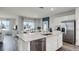 Modern kitchen with an island, stainless steel appliances, and an open concept design at 3719 Bluethread Way, Poinciana, FL 34759