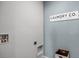 A well-appointed laundry area featuring a Laundry Co. sign and modern utility connections at 3719 Bluethread Way, Poinciana, FL 34759