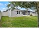 Backyard featuring a shed, brick patio, a screened-in porch and green lawn at 4051 Prairie Reserve Blvd, Orlando, FL 32824