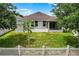 Large lawn with a shed, a screened-in porch, and a brick patio, all within a fenced-in yard at 4051 Prairie Reserve Blvd, Orlando, FL 32824