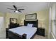 Bedroom features a ceiling fan, matching nightstands and dressers, and plenty of natural light at 4051 Prairie Reserve Blvd, Orlando, FL 32824