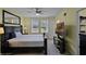 Bedroom with two beds, a ceiling fan, and a mounted TV for relaxation and entertainment at 4051 Prairie Reserve Blvd, Orlando, FL 32824