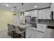 Bright kitchen with stainless appliances, granite counters, breakfast bar and tile flooring at 4051 Prairie Reserve Blvd, Orlando, FL 32824