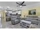 Open concept living room featuring tile floors, recessed lighting, and views to the kitchen at 4051 Prairie Reserve Blvd, Orlando, FL 32824