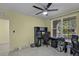 Sunny home office area with neutral colors, a ceiling fan, and a window view at 4051 Prairie Reserve Blvd, Orlando, FL 32824