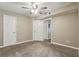 Relaxing bedroom with neutral carpet, ceiling fan and natural light at 485 Forestway Cir # 108, Altamonte Springs, FL 32701