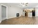 Open-concept living room with fireplace and hardwood flooring at 485 Forestway Cir # 108, Altamonte Springs, FL 32701