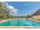 Beautiful community pool with a tranquil lake view and plenty of space to relax at 485 Forestway Cir # 108, Altamonte Springs, FL 32701
