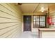 Inviting covered porch with a secure entry and a convenient fire extinguisher at 485 Forestway Cir # 108, Altamonte Springs, FL 32701