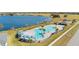 Beautiful aerial view of the community pool and surrounding nature preserve with lake views at 4977 Kaia Ave, Winter Haven, FL 33884