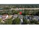 Drone shot of house in neighborhood with view of highway and trees at 5007 Bellthorn Dr, Orlando, FL 32837