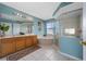 Bright bathroom featuring a tub, a glass-door shower, and a double-sink vanity at 5007 Bellthorn Dr, Orlando, FL 32837