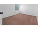 Clean, simple bedroom with neutral walls and plush carpet at 5007 Bellthorn Dr, Orlando, FL 32837