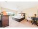 Bright and airy bedroom features a large bed and furniture at 5007 Bellthorn Dr, Orlando, FL 32837