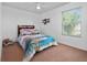 Cozy bedroom with a ceiling fan, window, and airplane-themed bedding at 5007 Bellthorn Dr, Orlando, FL 32837