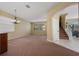 Spacious dining room with carpet, chandelier, and natural light at 5007 Bellthorn Dr, Orlando, FL 32837