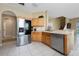 Well-lit kitchen features stainless steel appliances and tile flooring at 5007 Bellthorn Dr, Orlando, FL 32837