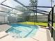 Refreshing in-ground pool is surrounded by a screened enclosure, providing a relaxing backyard oasis with ample space for leisure at 5007 Bellthorn Dr, Orlando, FL 32837