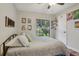 Comfortable bedroom featuring a ceiling fan and a window looking out onto the front yard at 520 Starstone Dr, Lake Mary, FL 32746