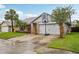 A well-maintained home featuring a two-car garage and basketball hoop on the driveway at 520 Starstone Dr, Lake Mary, FL 32746