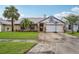 Charming single-Gathering home with well-manicured lawn, stone accents, and a two-car garage at 520 Starstone Dr, Lake Mary, FL 32746