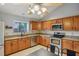 Functional kitchen featuring stainless steel appliances, granite countertops, and tile flooring at 520 Starstone Dr, Lake Mary, FL 32746
