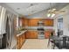 Functional kitchen featuring stainless steel appliances, granite countertops, and tile flooring at 520 Starstone Dr, Lake Mary, FL 32746