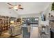 Spacious living room with vaulted ceilings, fireplace, and sliding glass doors to the lanai at 520 Starstone Dr, Lake Mary, FL 32746