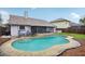 A serene backyard pool with ample patio space, ideal for entertaining or enjoying a quiet swim at 520 Starstone Dr, Lake Mary, FL 32746