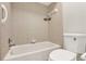 Clean bathroom features a shower-tub combo, tiled walls, and modern toilet at 600 Northern Way # 103, Winter Springs, FL 32708