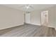 Spacious bedroom featuring modern ceiling fan and durable wood-look flooring at 600 Northern Way # 103, Winter Springs, FL 32708