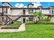 Inviting two-story condo with well-manicured lawn and lush tropical landscaping at 600 Northern Way # 103, Winter Springs, FL 32708