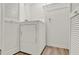 Bright laundry room with ample shelving and modern washer and dryer at 600 Northern Way # 103, Winter Springs, FL 32708