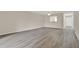 Spacious living room with ceiling fan and pass-through window to the kitchen at 600 Northern Way # 103, Winter Springs, FL 32708