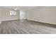 Inviting living room with wood-look floors, ceiling fan, and pass-through kitchen window at 600 Northern Way # 103, Winter Springs, FL 32708