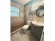 Updated bathroom with a modern vanity, tiled shower, and stylish fixtures at 605 Pleasantdale Dr, Wildwood, FL 34785