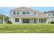 Large, well-kept backyard perfect for entertaining, with a covered patio and plenty of space for outdoor furniture at 6125 Village Edge Pl, Sanford, FL 32771