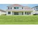 Expansive backyard with lush green grass, providing ample space for outdoor activities and relaxation at 6125 Village Edge Pl, Sanford, FL 32771