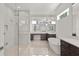 Luxurious bathroom with glass shower, soaking tub, and modern vanity at 6125 Village Edge Pl, Sanford, FL 32771