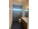 Bathroom featuring walk-in shower and double sinks at 6125 Village Edge Pl, Sanford, FL 32771