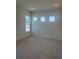Bright bedroom featuring neutral carpet, recessed lighting, and large windows at 6125 Village Edge Pl, Sanford, FL 32771