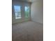 Well-lit bedroom features plush carpet and large windows at 6125 Village Edge Pl, Sanford, FL 32771